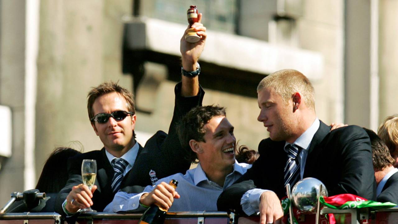 Michael Vaughan, Gary Pratt and Andrew Flintoff ride on top of the bus in the victory parade, London, September 13, 2005