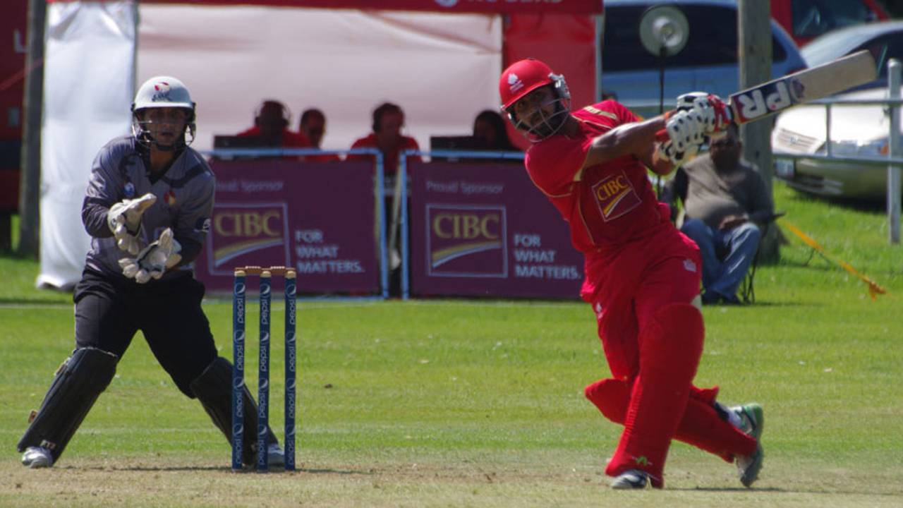 Hiral Patel lofts the ball during his half-century, Canada v UAE, ICC World Cricket League Championship, King City, August 8, 2013