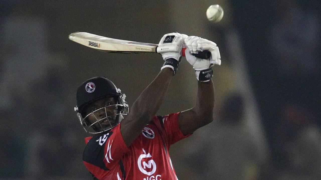 Navin Stewart slogs over cover, Trinidad & Tobago v Sunrisers Hyderabad, Group B, Champions League 2013, Mohali, September 24, 2013