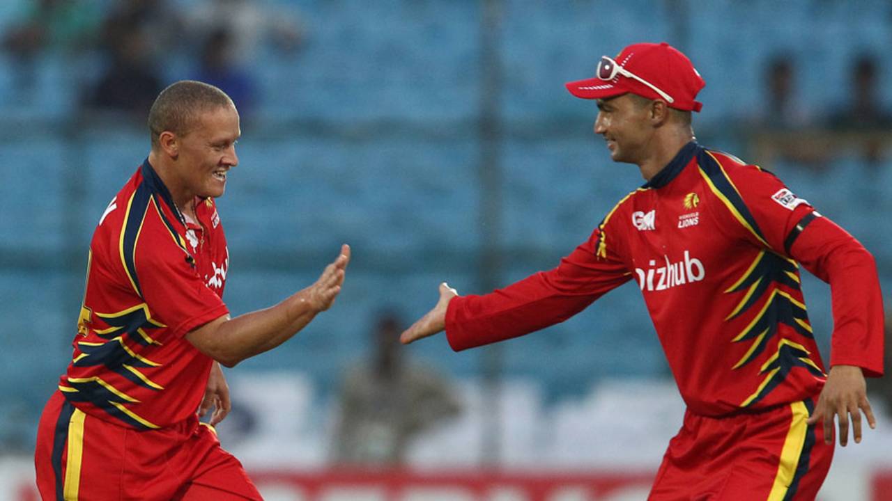 Ethan O'Reilly celebrates a wicket with Alviro Petersen, Lions v Otago, Group A, Champions League 2013, Jaipur, September 29, 2013