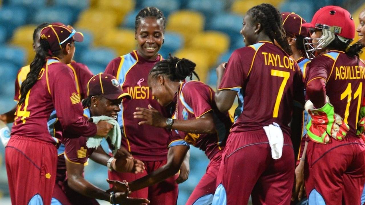 Shaquana Quintyne is mobbed by her teammates after her maiden five-for, West Indies v England, Women's Tri-Nation T20, Bridgetown, October 18, 2013