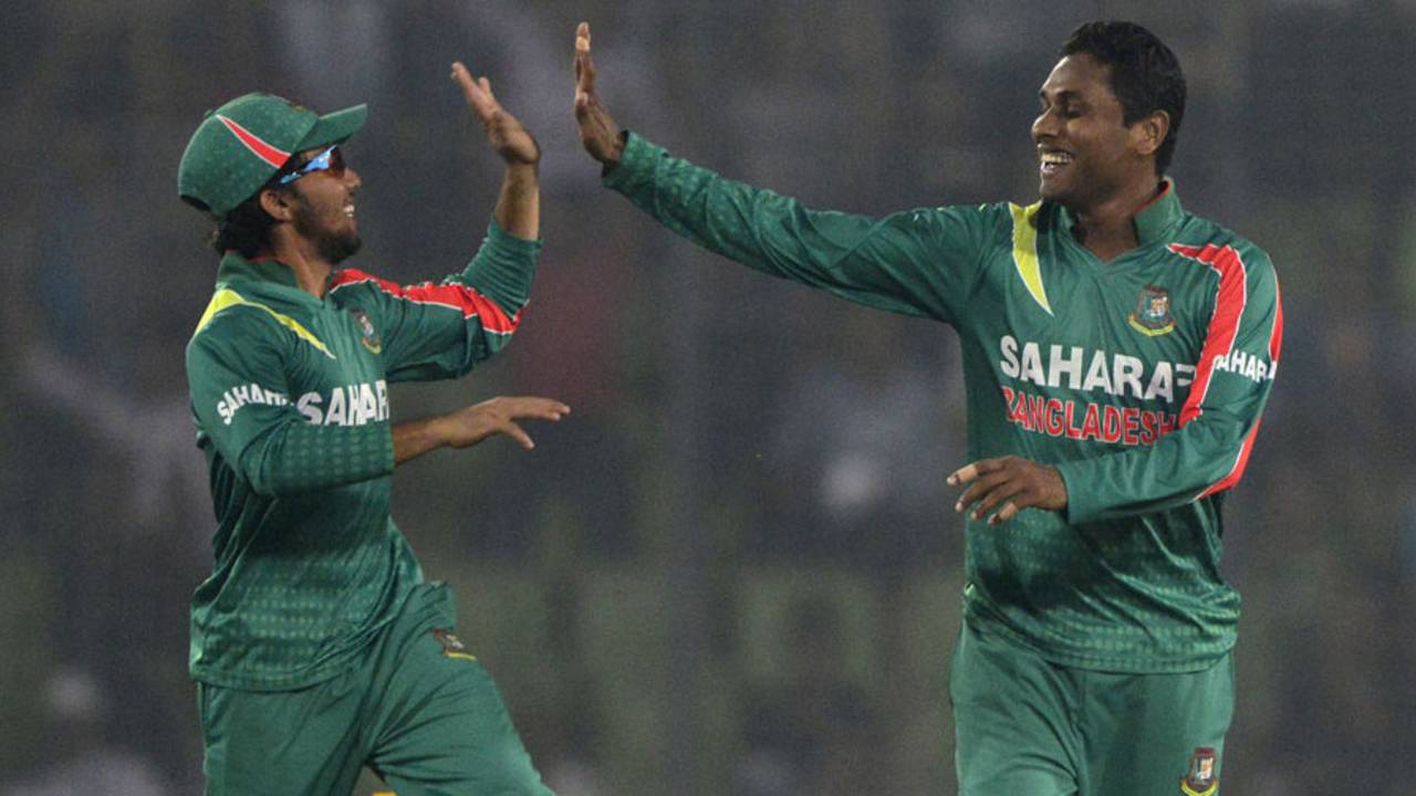 Mominul Haque and Sohag Gazi celebrate James Neesham's wicket, Bangladesh v New Zealand, 2nd ODI, Mirpur, October 31, 2013