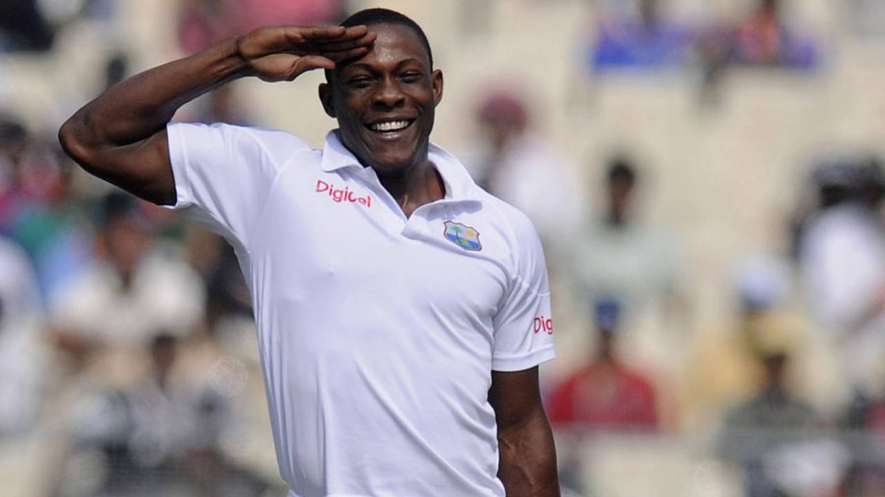 Sheldon Cottrell salutes towards the West Indies dressing room after dismissing Cheteshwar Pujara, India v West Indies, 1st Test, Kolkata, 2nd day, November 7, 2013