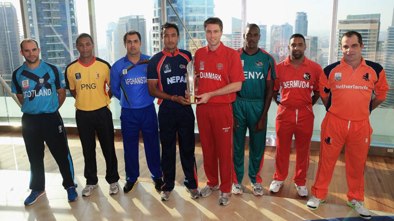 The various captains pose with World Twenty20 Qualifiers trophy, Dubai, November 14, 2013