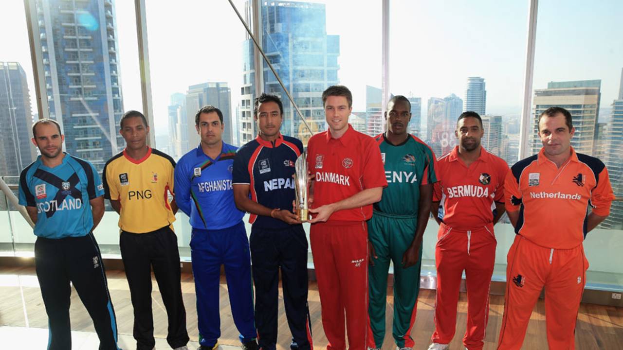 The various captains pose with World Twenty20 Qualifiers trophy, Dubai, November 14, 2013