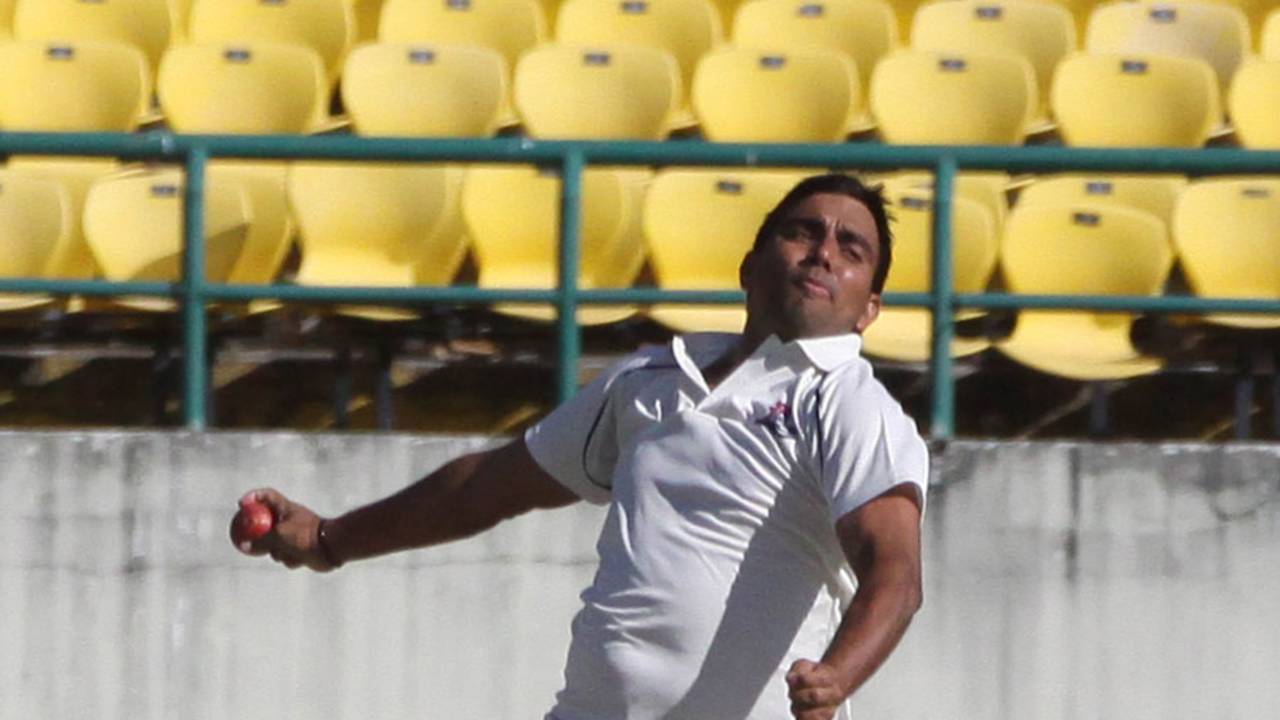 Vikramjeet Malik gets ready to release the ball 