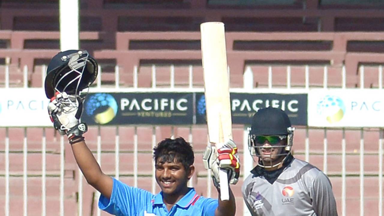 Akhil Herwadkar raises his bat after scoring a century, United Arab Emirates Under-19s v India Under-19s, Under-19 Asia Cup, Sharjah, December 28, 2013 