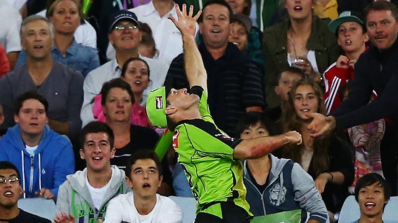 Cameron Borgas jumps in vain to catch the ball, Sydney Thunder v Brisbane Heat, Big Bash League, Sydney, January 8, 2014