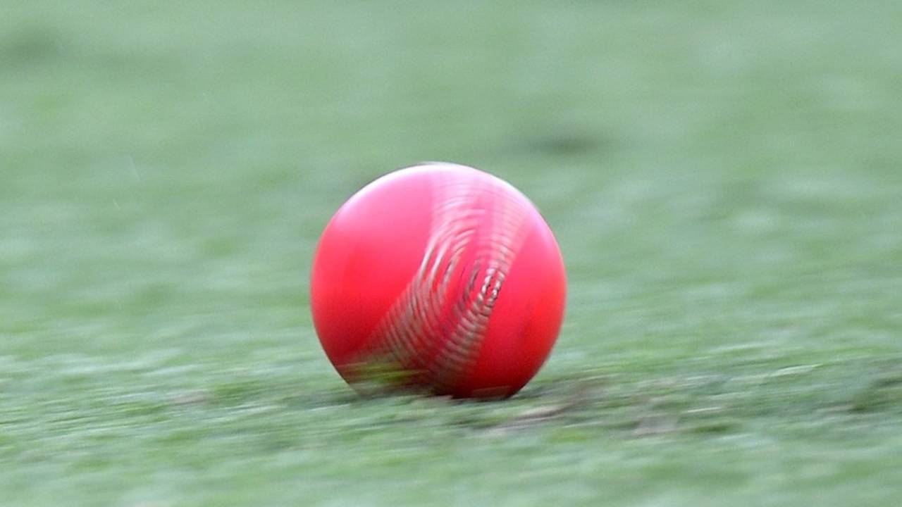 The pink ball rolls across the Gabba outfield, Queensland v Western Australia, Sheffield Shield, Brisbane, 1st day, March 3, 2014