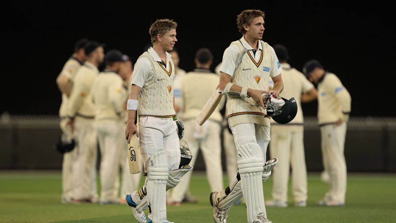 Xavier Doherty and Luke Butterworth walk off after securing the draw, Victoria v Tasmania, Sheffield Shield, Melbourne, 4th day, March 6, 2014