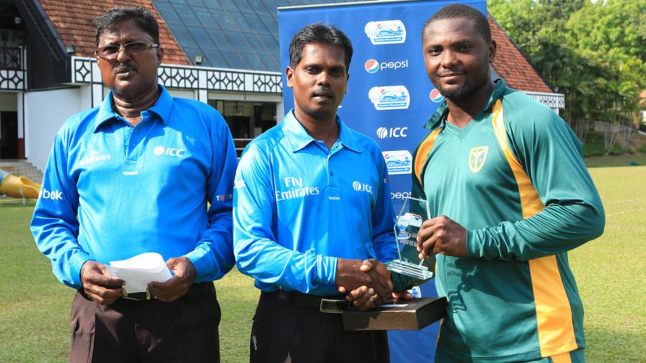 Endurance Ofem receives the Man-of-the-Match award, Nigeria v Guernsey, ICC World Cricket League Division Five, Kuala Lumpur, March 7, 2014