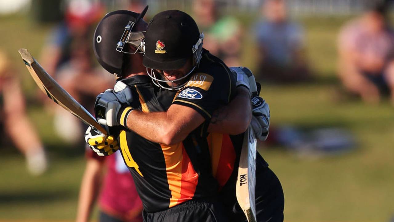 Luke Ronchi and Luke Woodcock celebrate the winning runs, Northern Districts v Wellington, The Ford Trophy final, Mount Maunganui, April 5, 2014