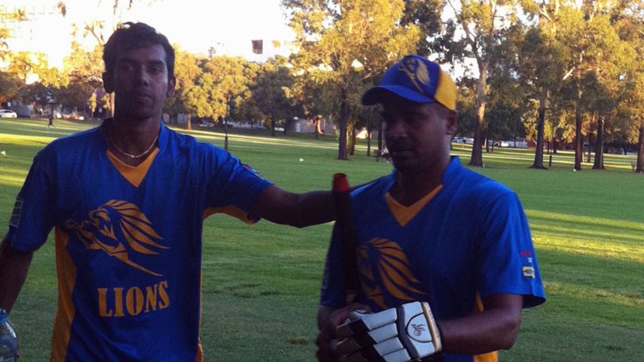 Suresh Perera walks back after scoring a century for the Sri Lankan Lions in Perth
