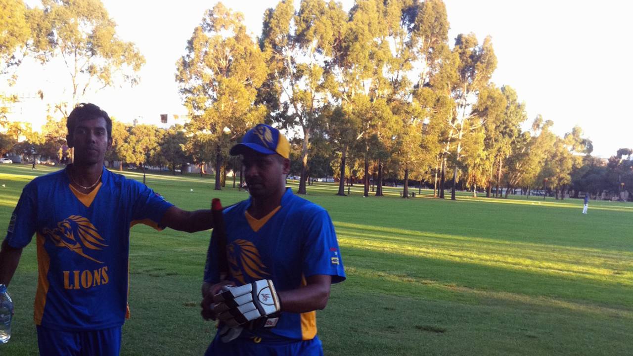 Suresh Perera walks back after scoring a century for the Sri Lankan Lions