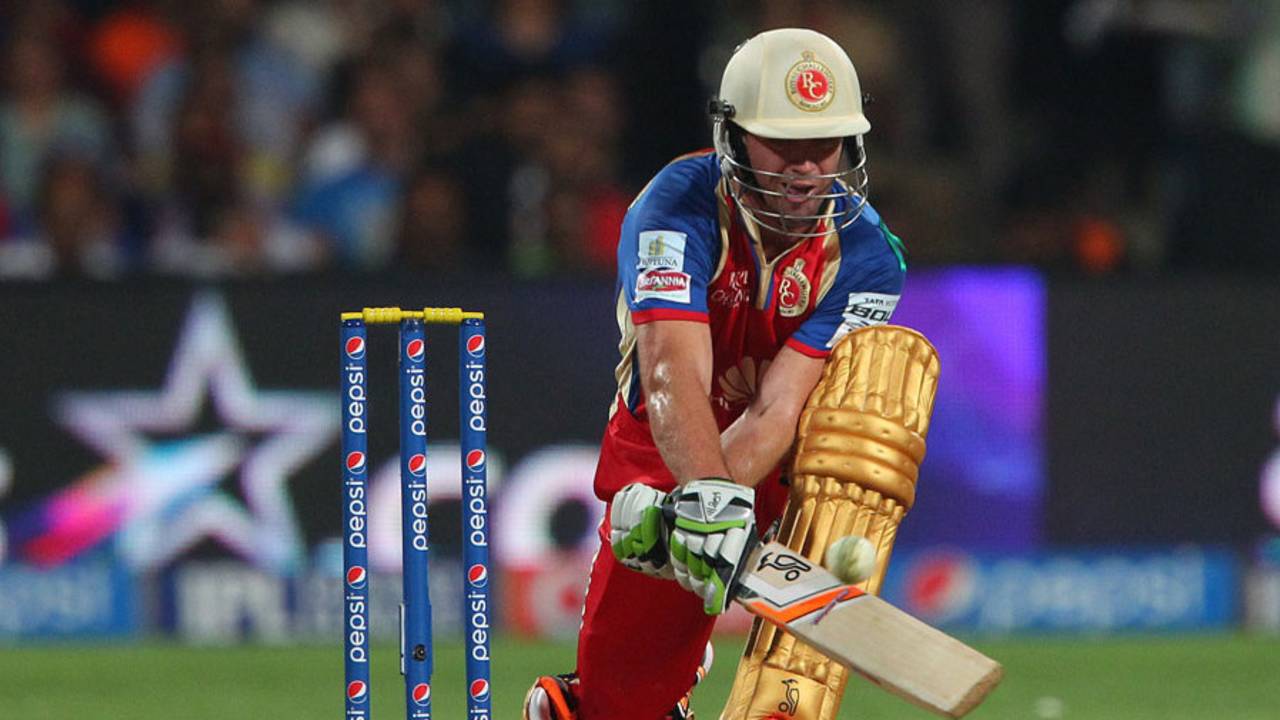 AB de Villiers reverse sweeps on the way to his 32-ball 58, Royal Challengers Bangalore v Rajasthan Royals, IPL 2014, Bangalore, May 11, 2014
