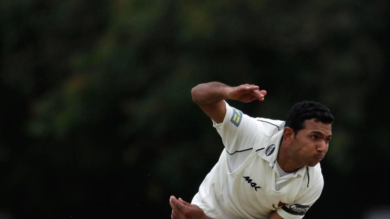 Naved Arif runs in to bowl