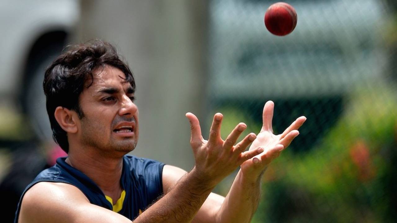 Grab the opportunity: Saeed Ajmal prepares to put his hands under the ball, Galle, August 4, 2014