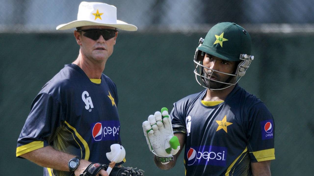 File photo - Grant Flower, Pakistan batting coach, chats to Asad Shafiq&nbsp;&nbsp;&bull;&nbsp;&nbsp;AFP