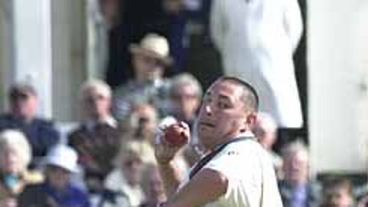 Ian Austin bowls from the Pavilion End