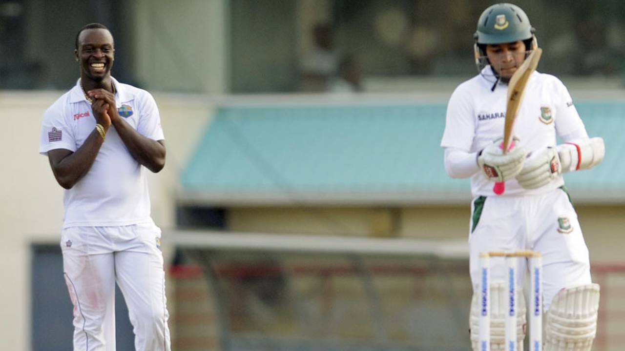 Kemar Roach smiles after bowling a delivery to Mushfiqur Rahim, West Indies v Bangladesh, 2nd Test, St. Lucia, 2nd day, September 14, 2014
