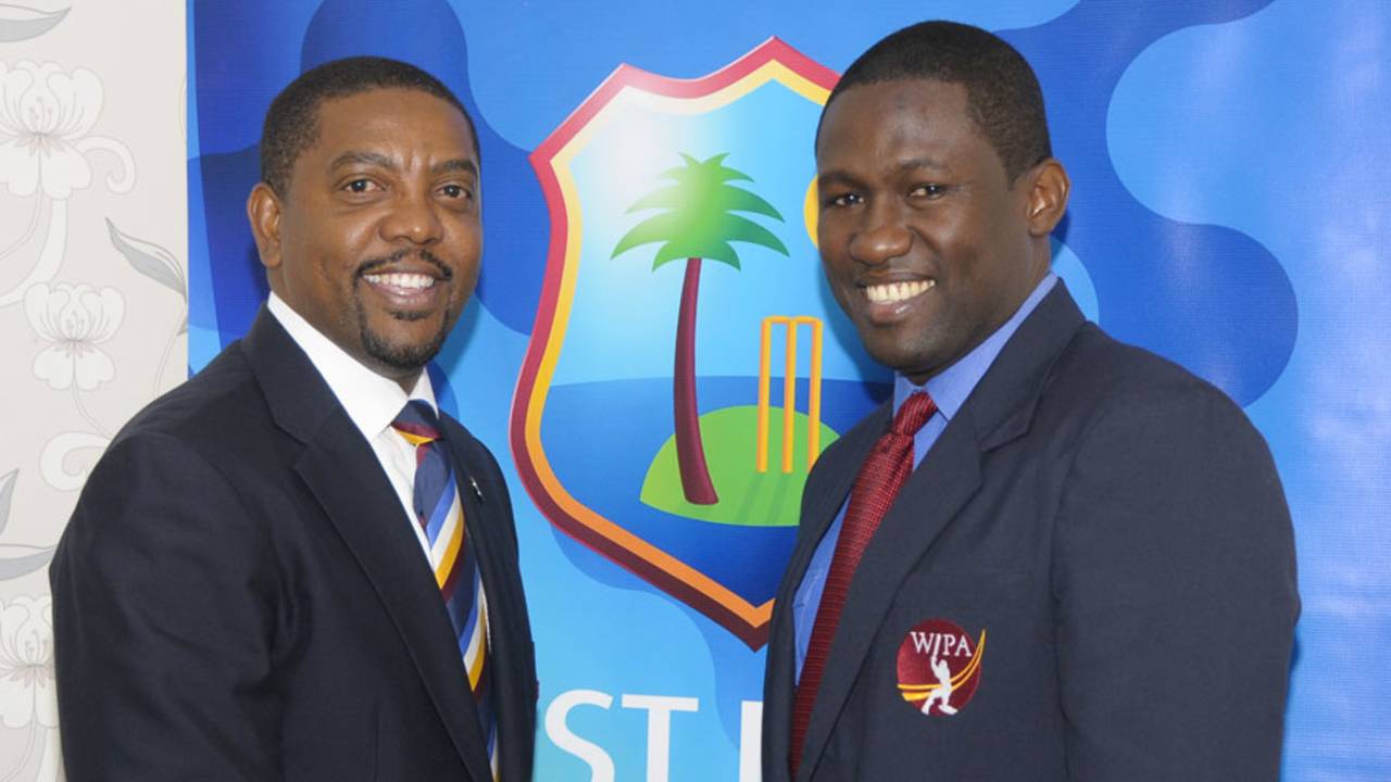 Dave Cameron, the WICB president, and Wavell Hinds, the WIPA president, at the agreement-signing ceremony, Bridgetown, September 18, 2014