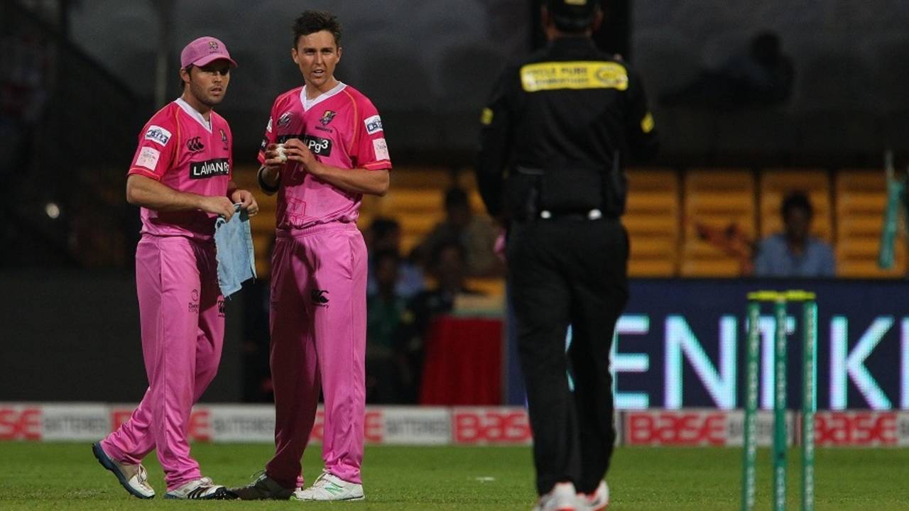 Daniel Flynn and Trent Boult wipe the dew off the ball, Barbados Tridents v Northern Districts, Champions League T20, Group B, Bangalore, September 30, 2014