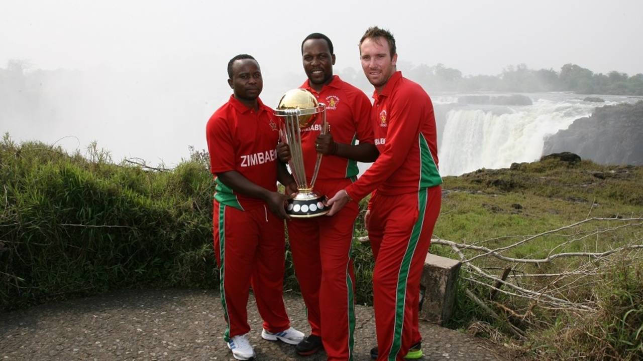 Prosper Utseya, Hamilton Masakadza and Brendan Taylor with the World Cup trophy at Victoria falls, September 30, 2014