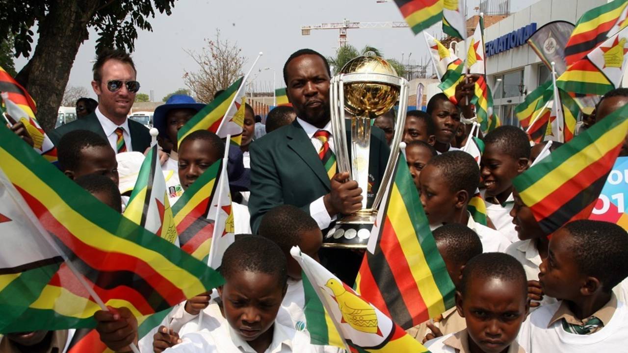 Hamilton Masakadza and Brendan Taylor with the World Cup trophy, September 30, 2014
