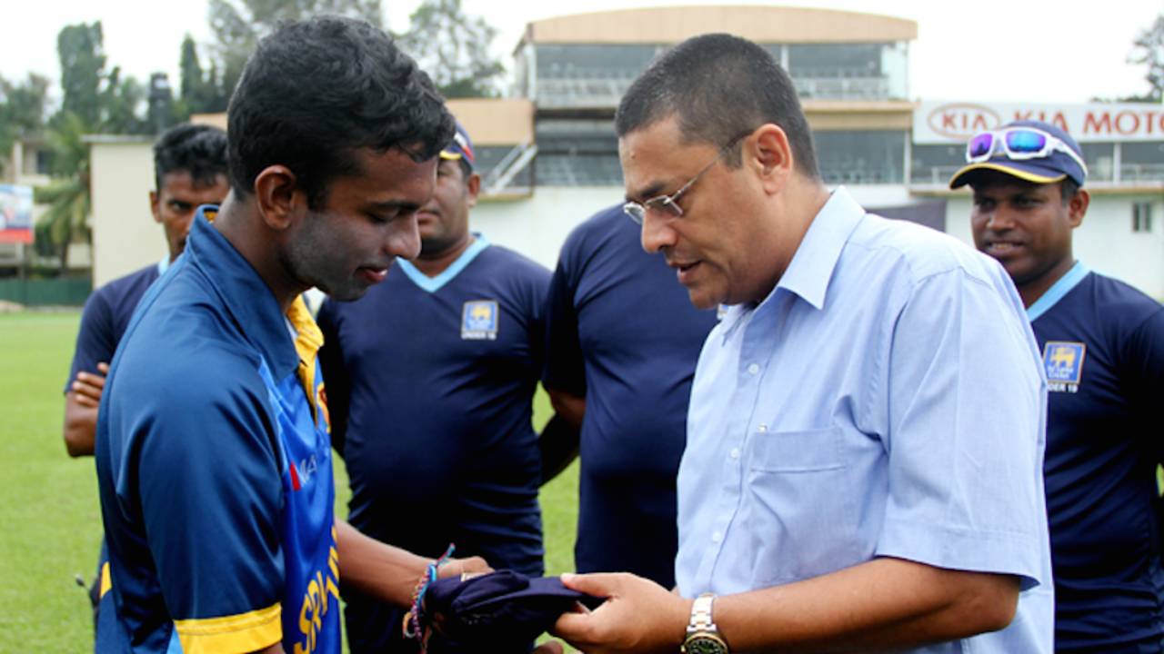 Saveen Nanayakkara receives his cap on Under-19 debut from Ranjan Madugalle, Colombo, October 3, 2014