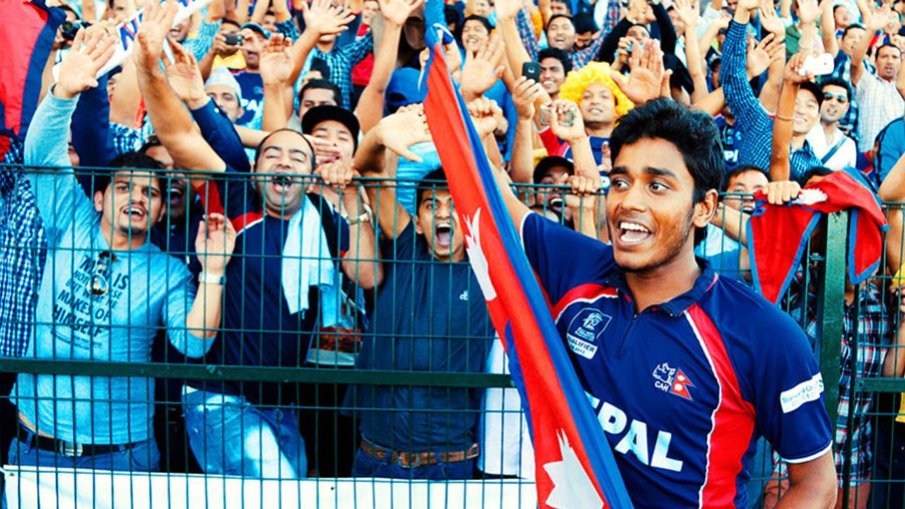 Avinash Karn celebrates with Nepal's fans after they qualified for the World T20, Hong Kong v Nepal, ICC World Twenty20 Qualifier, quarter-final, Abu Dhabi, November 27, 2013