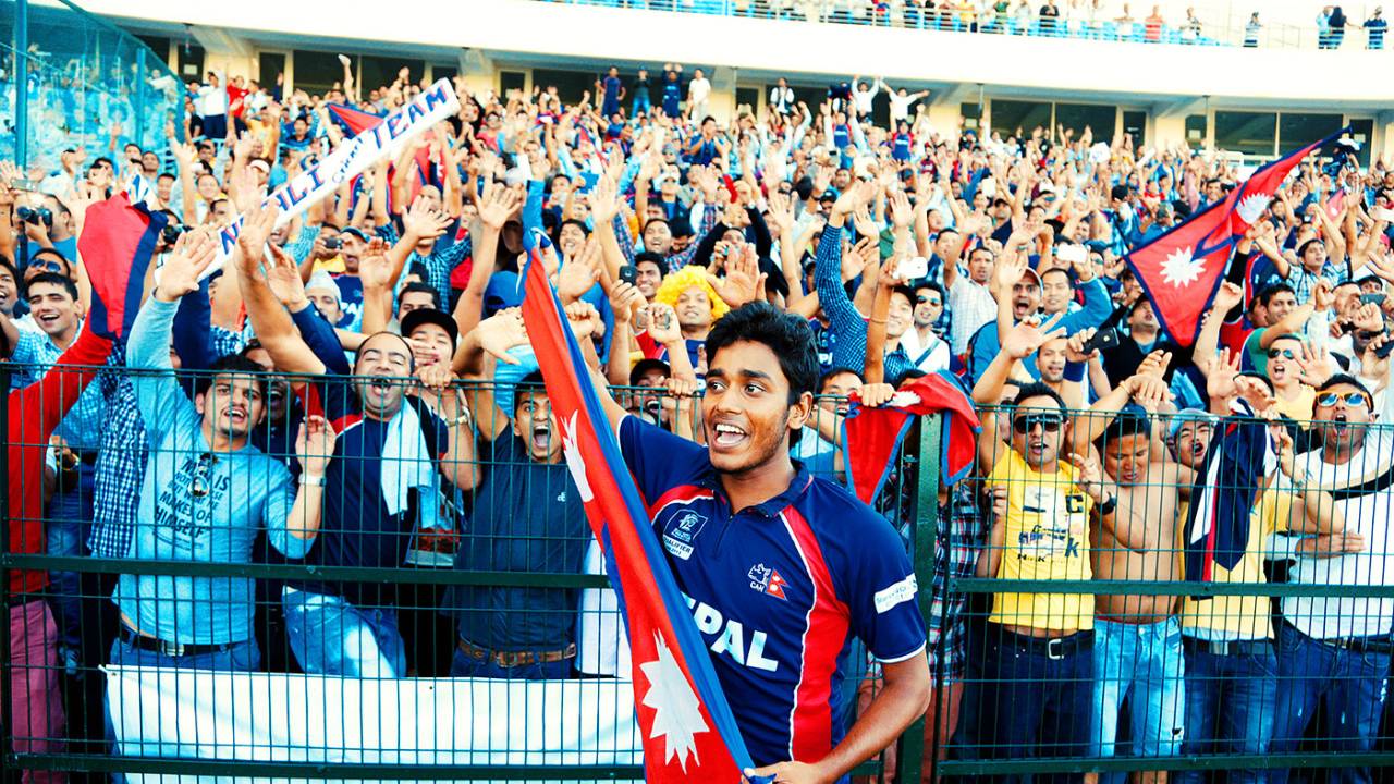 Avinash Karn celebrates with Nepal's fans after they qualified for the World T20