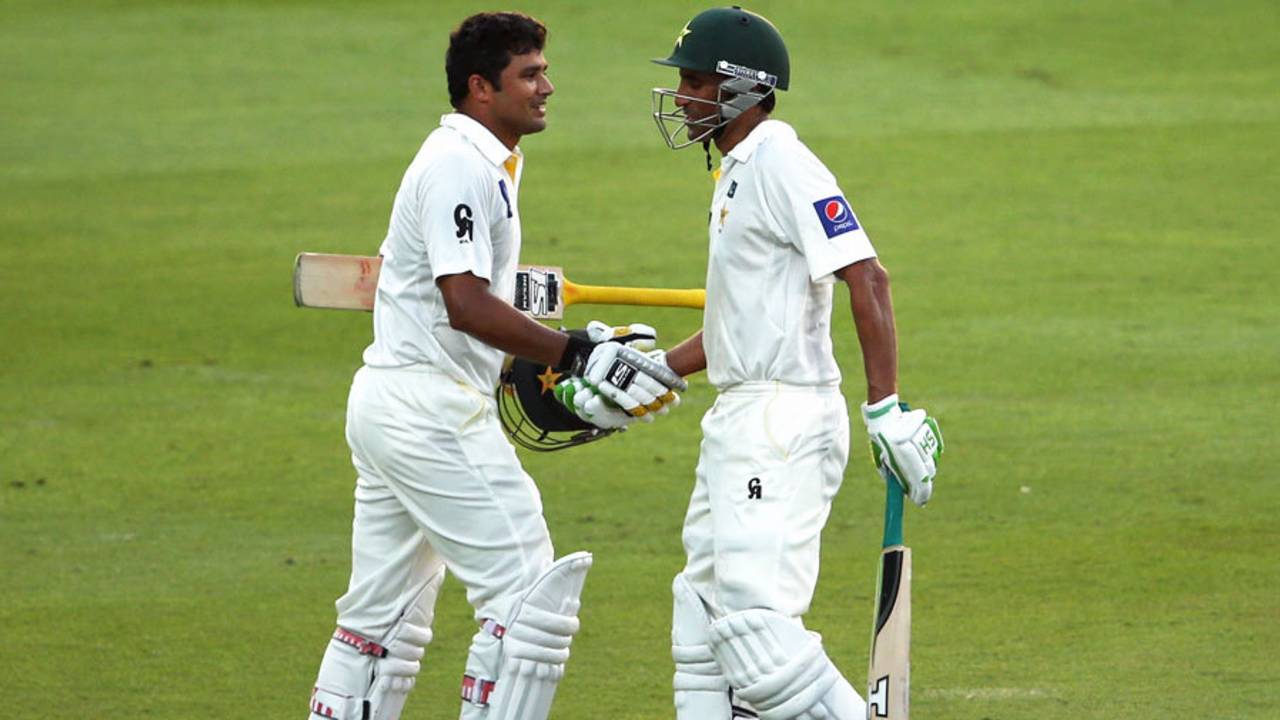 Younis Khan congratulates Azhar Ali on his century, Pakistan v Australia, 2nd Test, Abu Dhabi, 1st day, October 30, 2014