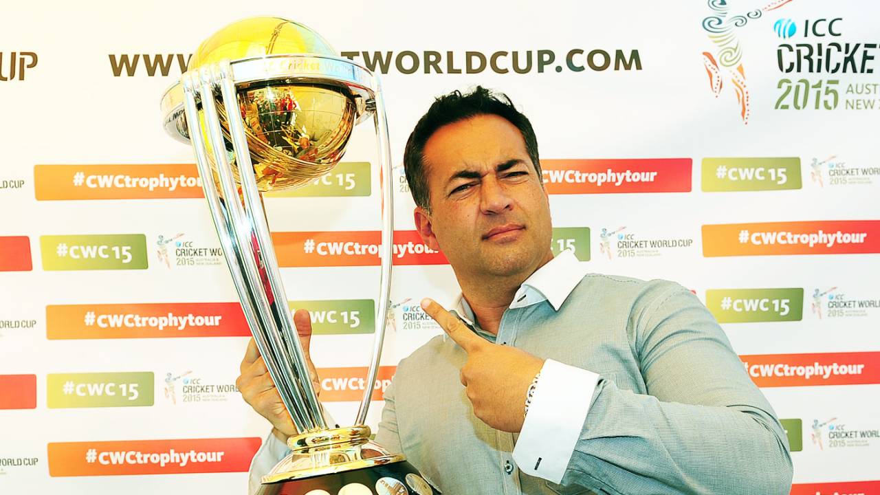 Former England captain Adam Hollioake poses with the World Cup trophy, Egbaston, August 23, 2014