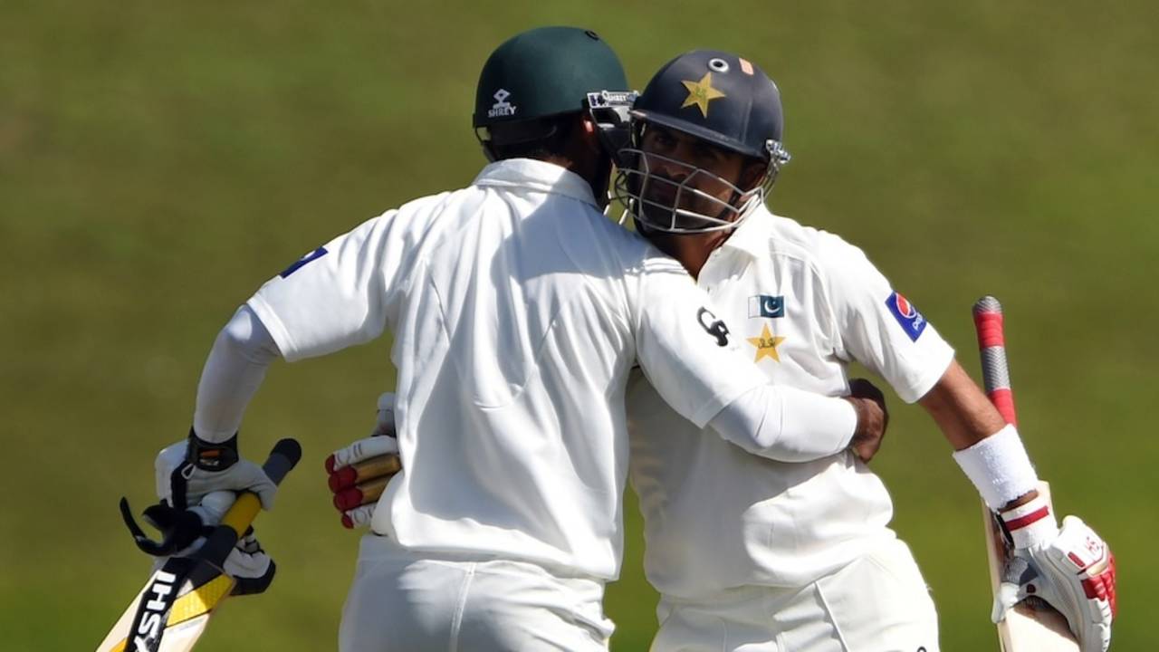 Ahmed Shehzad and Mohammad Hafeez congratulate each other, Pakistan v New Zealand, 1st Test, Abu Dhabi, 1st day, November 9, 2014