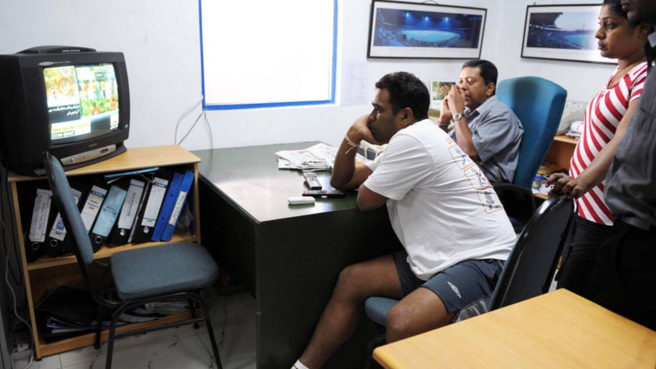 Ravindra Pushpakumara follows the events in Lahore on television, Colombo, March 3, 2009