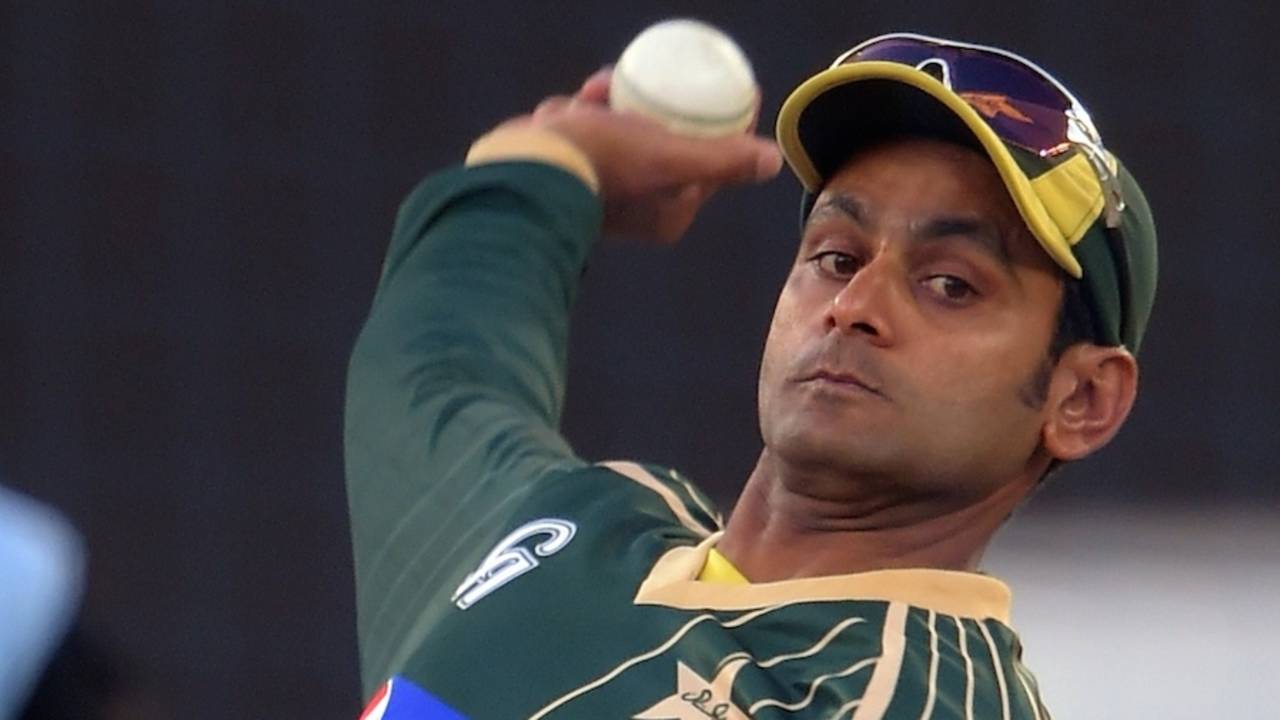 Mohammad Hafeez bowls in the nets the day he is suspended from bowling in international cricket, Dubai, December 7, 2014