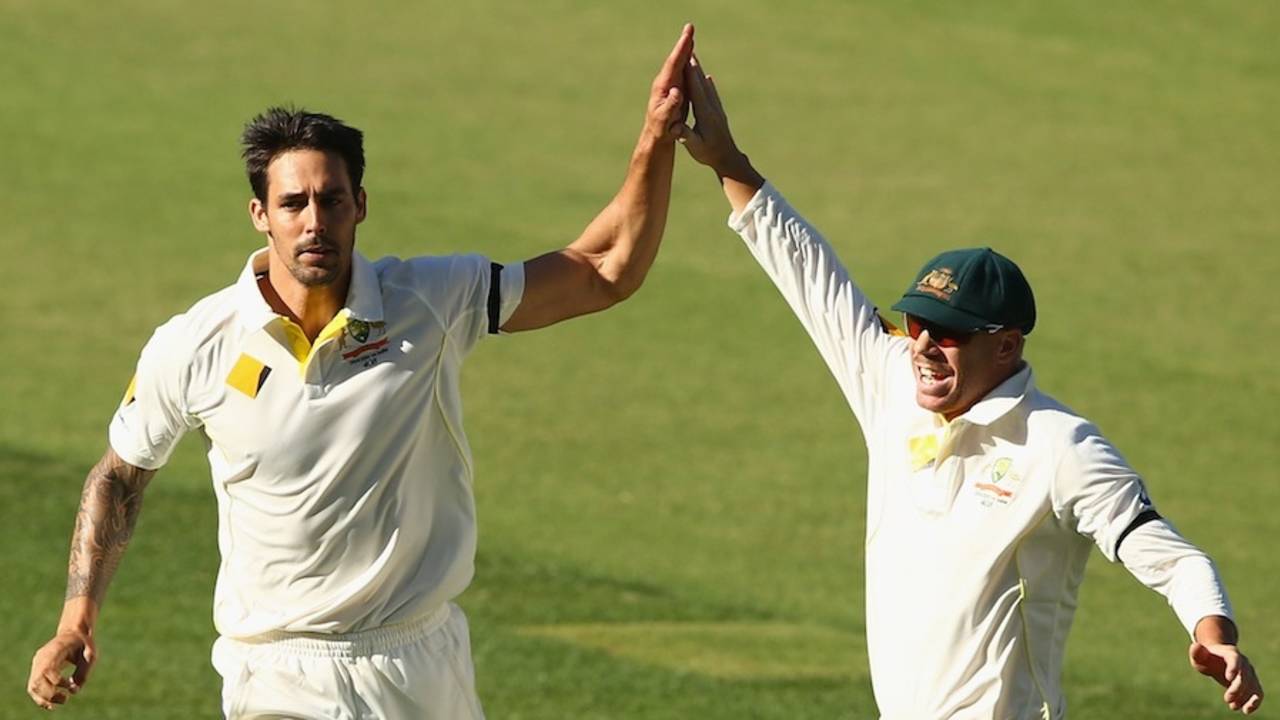 Mitchell Johnson and David Warner celebrate Virat Kohli's wicket, Australia v India, 1st Test, Adelaide, 3rd day, December 11, 2014