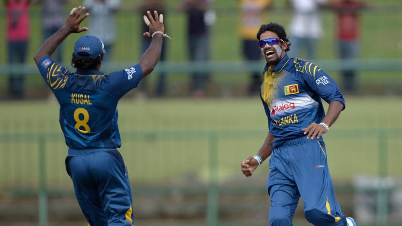 Sachithra Senanayake exults after trapping Alastair Cook lbw, Sri Lanka v England, 5th ODI, Pallekele, December 11, 2014