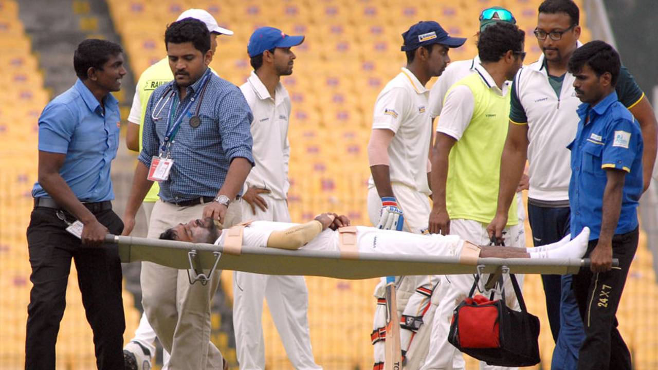 Rohan Bhosale is stretchered off the field, Tamil Nadu v Railways, Ranji Trophy 2014-15, Group A, Chennai, December 30, 2014