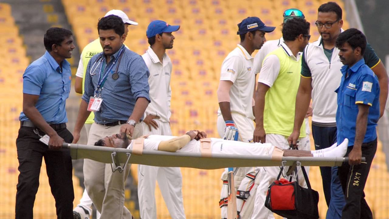 Rohan Bhosale is stretchered off the field