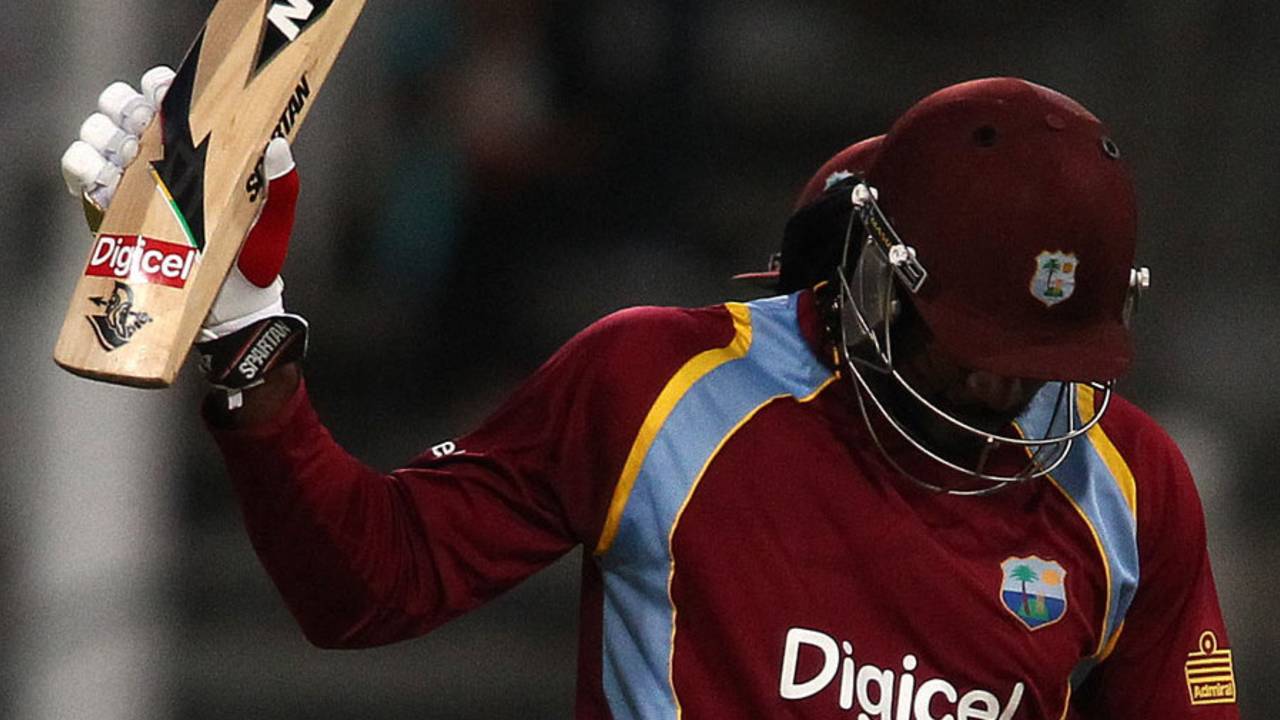 Chris Gayle holds up his bat on passing 50, South Africa v West Indies, 1st T20, Cape Town, January 9, 2015