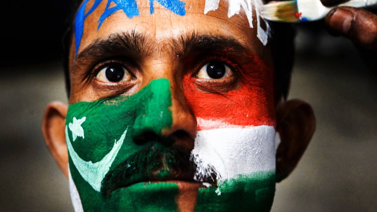 A fan with his face painted in the colours of India and Pakistan, ahead of the World Cup semi-final between the two teams, March 29, 2011