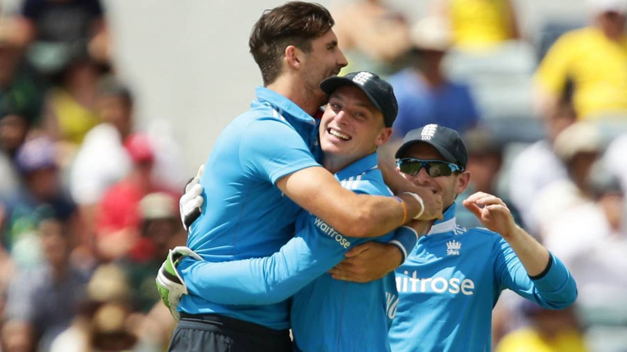 Steven Finn and Jos Buttler embrace after running Mitchell Marsh out, Australia v England, Carlton Mid Tri-series final, Perth, February 1, 2015