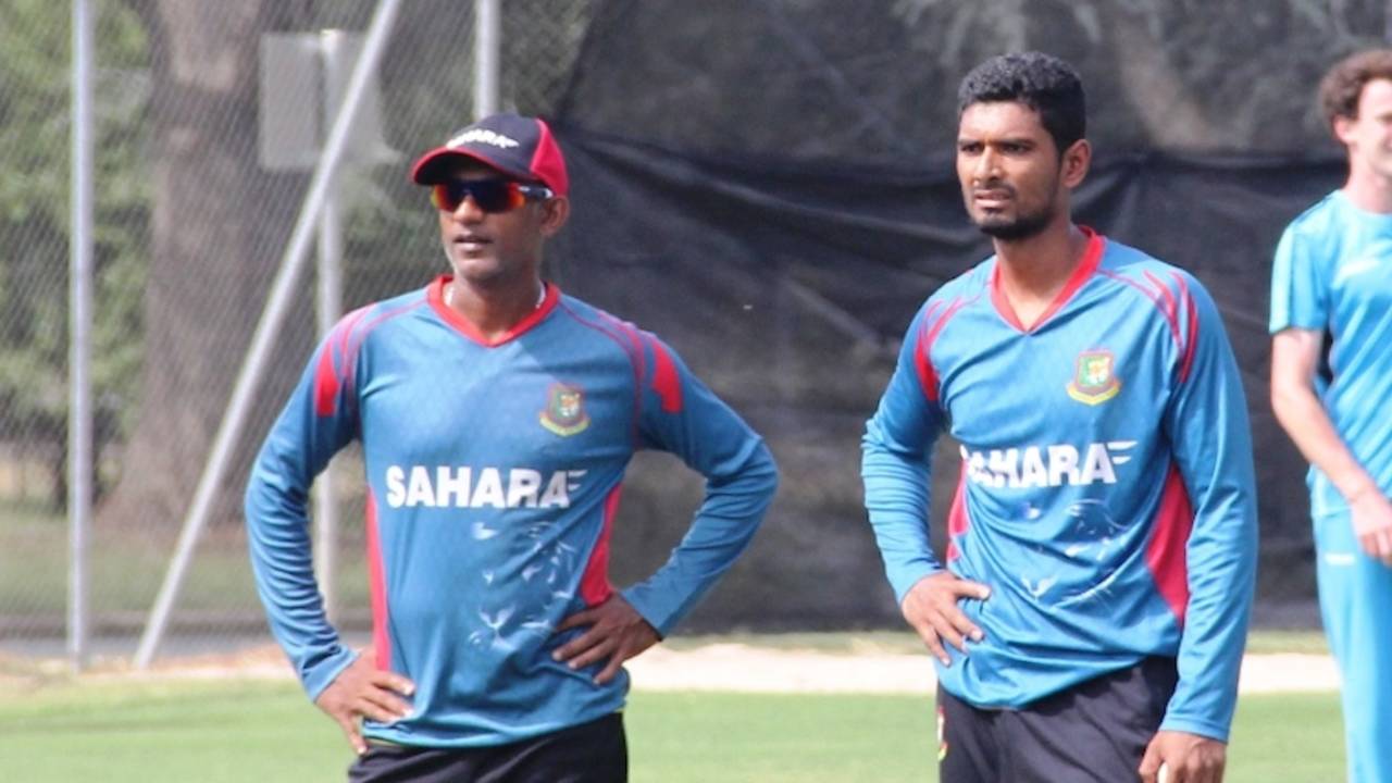 Mahmudullah and Ruwan Kalpage watch the Bangladesh players practice