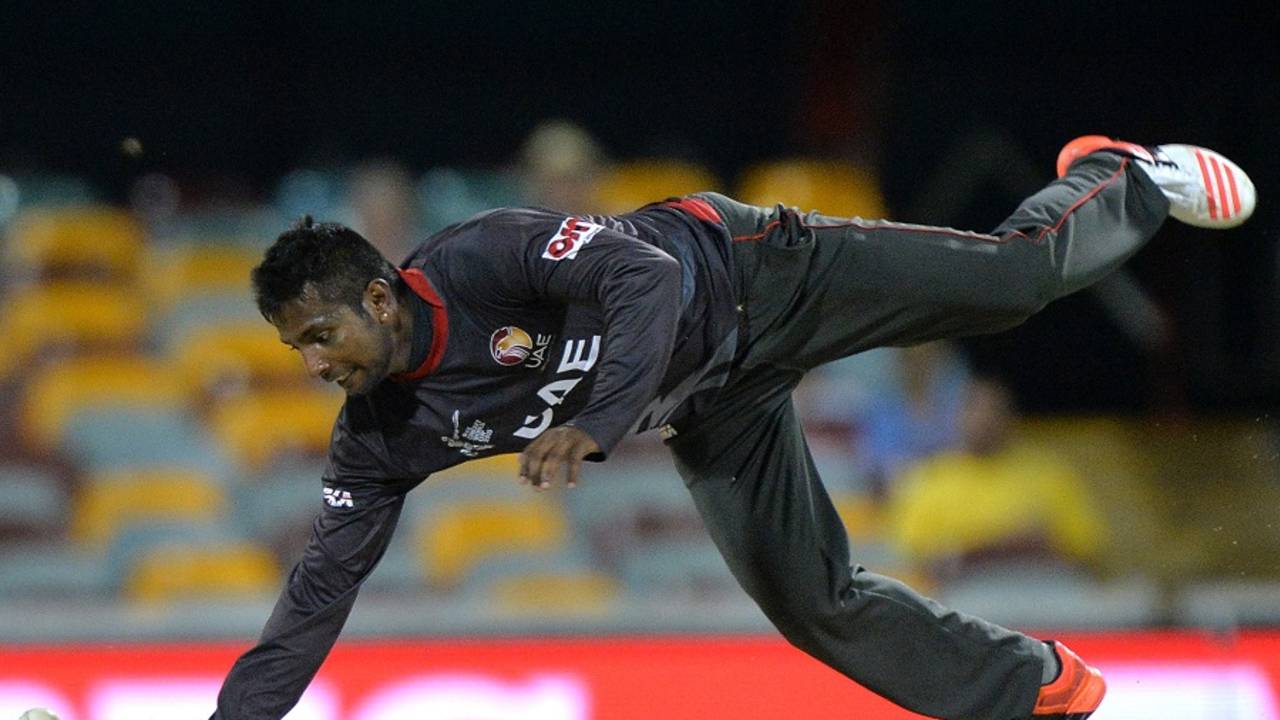 Krishna Chandran dives to stop the ball