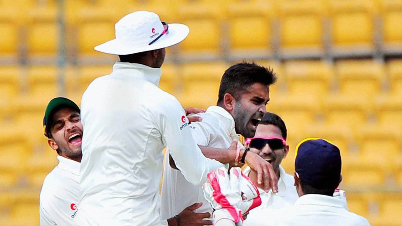 Vinay Kumar is mobbed after taking a wicket, Karnataka v Mumbai, Ranji Trophy, Semi-final, Bangalore, 1st day, February 25, 2015