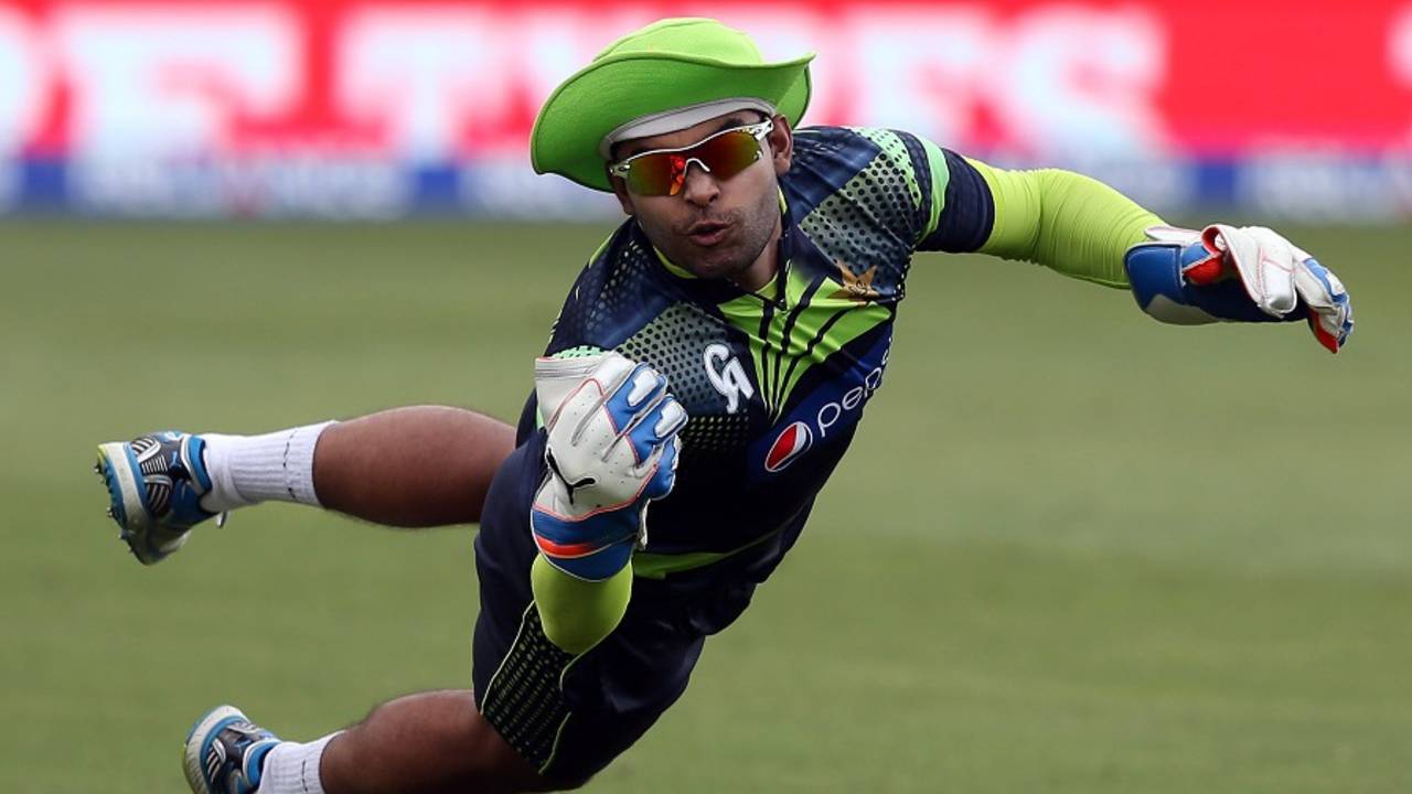 Umar Akmal dives in an attempt to catch the ball during training, Napier, March 3, 2015