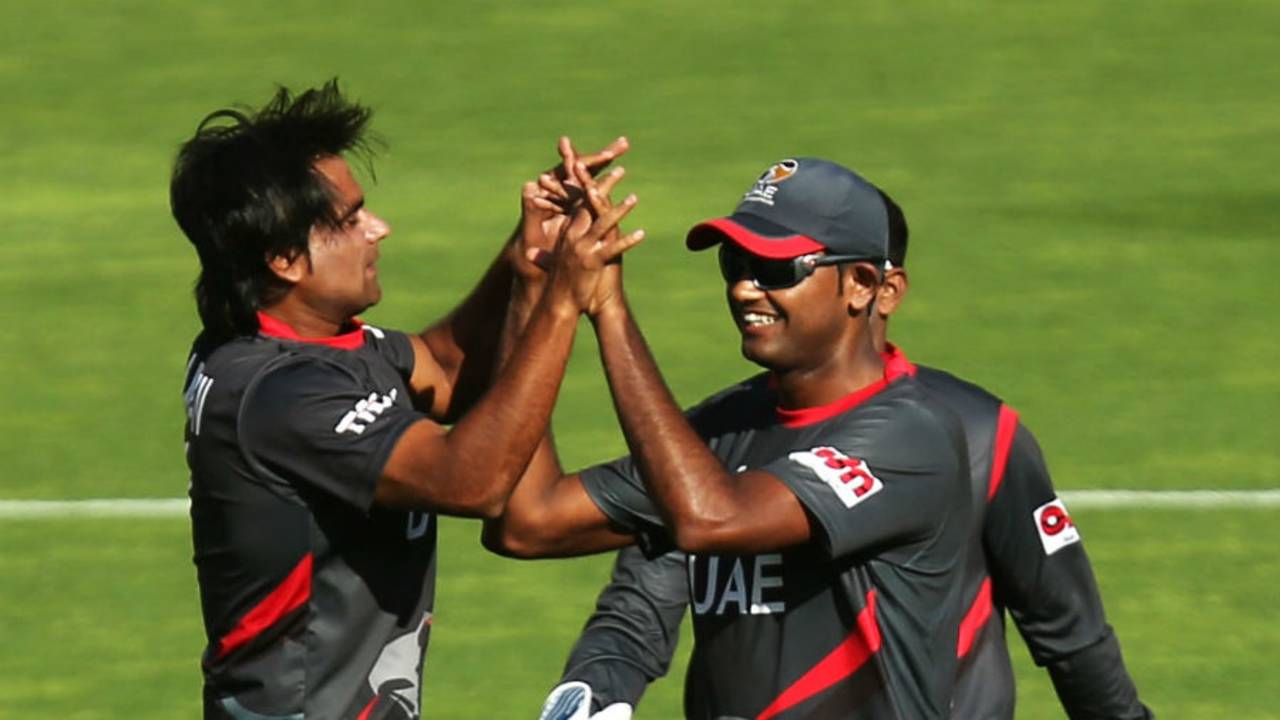 Kamran Shazad is congratulated after he dismissed AB de Villiers 