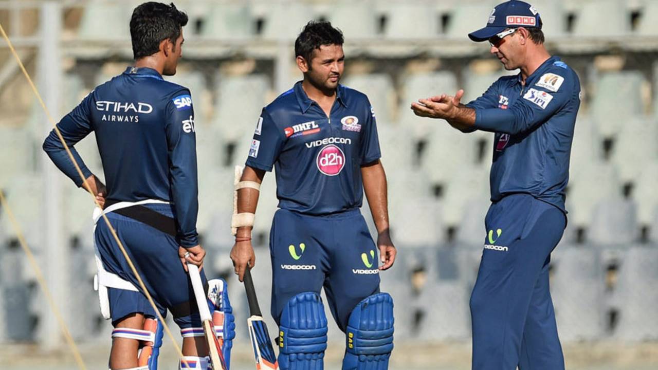 Mumbai Indians' head coach Ricky Ponting shares a few tips with Parthiv Patel during a training session, IPL 2015, Mumbai, March 31, 2015