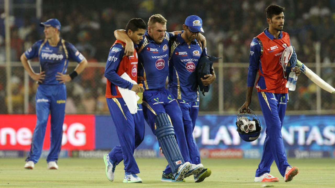 Aaron Finch is helped off the field after an injury, Rajasthan Royals v Mumbai Indians, IPL 2015, Ahmedabad, April 14, 2015